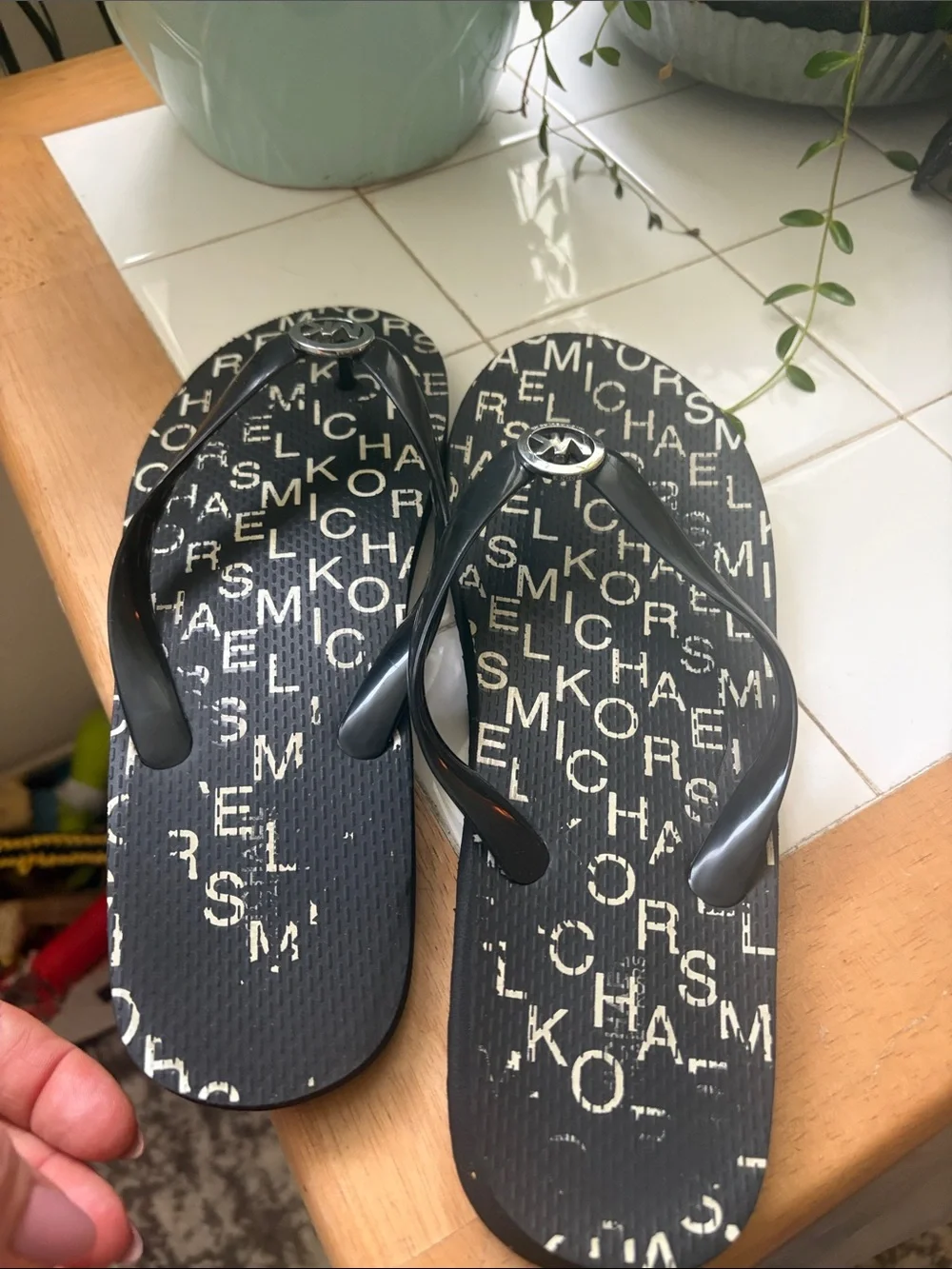 Michael Kors Black Logo Print Girls' Flip Flops with Silver MK Medallion